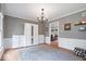 Inviting living room with plush rug, neutral colors and white storage furnishings at 13363 Lantern Rd, Fishers, IN 46038