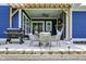 Covered patio with grill, chairs, outdoor dining table, and an outdoor hammock at 1404 Rosebank Dr, Westfield, IN 46074