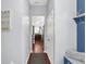Hallway leading to the kitchen, with a view of the mudroom and natural light at 1404 Rosebank Dr, Westfield, IN 46074