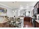 Open concept kitchen with a granite island, pendant lighting, and dark wood floors at 1404 Rosebank Dr, Westfield, IN 46074