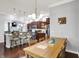 Kitchen and dining area with a large wooden table and chairs, bright kitchen, and hardwood floors at 1404 Rosebank Dr, Westfield, IN 46074