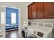Laundry area with modern washer and dryer, and mudroom in the background at 1404 Rosebank Dr, Westfield, IN 46074