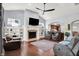 Spacious living room with a fireplace, hardwood floors, and an open layout to the kitchen at 1404 Rosebank Dr, Westfield, IN 46074