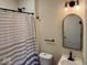 Updated bathroom features new vanity, lighting and shower with neutral tones at 1405 S Ribble Ave, Muncie, IN 47302