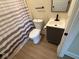 Nicely renovated bathroom with modern fixtures and neutral finishes at 1405 S Ribble Ave, Muncie, IN 47302