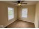 Bright bedroom with windows and neutral tones, filled with natural light at 1405 S Ribble Ave, Muncie, IN 47302