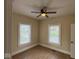 Bedroom with wood flooring, fresh paint, and bright windows for natural light at 1405 S Ribble Ave, Muncie, IN 47302