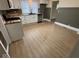 Open kitchen with new appliances, light cabinets, and neutral flooring at 1405 S Ribble Ave, Muncie, IN 47302