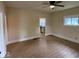 Open living room featuring wood flooring, a ceiling fan, and an open floor plan at 1405 S Ribble Ave, Muncie, IN 47302