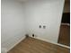 A versatile finished room with wood-look floors and paneled walls, with laundry connections ready at 1405 S Ribble Ave, Muncie, IN 47302