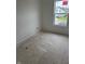 A bedroom featuring neutral freshly painted walls and a view from the window at 1439 Elm St, Martinsville, IN 46151