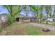 View of the backyard and detached garage and a peek of the house beyond at 1529 E Gimber St, Indianapolis, IN 46203