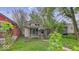 Charming home with a covered front porch and mature trees at 1529 E Gimber St, Indianapolis, IN 46203