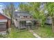 Charming home with a covered front porch and mature trees at 1529 E Gimber St, Indianapolis, IN 46203