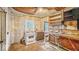 View of kitchen with sink, stove, cabinets, and window at 1529 E Gimber St, Indianapolis, IN 46203