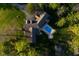 Aerial view of the home featuring a swimming pool and verdant surroundings at 15617 Westfield Blvd, Carmel, IN 46033