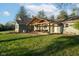 Backyard view of home with covered outdoor seating area perfect for relaxation and entertainment at 15617 Westfield Blvd, Carmel, IN 46033