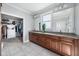 Spacious bathroom featuring double sinks, ample countertop space, and a walk in closet at 15617 Westfield Blvd, Carmel, IN 46033
