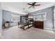 Cozy bedroom with a bunk bed, two large windows, and carpet flooring at 15617 Westfield Blvd, Carmel, IN 46033