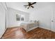 Bright bedroom with hardwood floors, a large window, and neutral decor at 15617 Westfield Blvd, Carmel, IN 46033