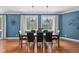 Bright dining room with hardwood floors, natural light, and views of the surrounding landscape at 15617 Westfield Blvd, Carmel, IN 46033
