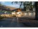 View of a home with a charming porch and an attached three-car garage at 15617 Westfield Blvd, Carmel, IN 46033