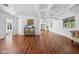 Expansive living room with hardwood floors, neutral walls, and a coffered ceiling at 15617 Westfield Blvd, Carmel, IN 46033