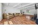 Comfortable living room with hardwood floors, sofa, and a view of the fireplace at 15617 Westfield Blvd, Carmel, IN 46033