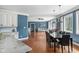 Open concept home with a living room, dining area, and kitchen, featuring hardwood floors at 15617 Westfield Blvd, Carmel, IN 46033