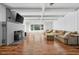 Inviting living room boasting hardwood floors, a brick fireplace, and a large sofa at 15617 Westfield Blvd, Carmel, IN 46033
