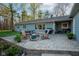 Outdoor patio featuring a fire pit, dining area, and ample seating space at 15617 Westfield Blvd, Carmel, IN 46033