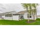 Charming backyard with lush green grass, patio area, grill, and screened porch for outdoor enjoyment at 16044 Loire Valley Dr, Fishers, IN 46037