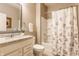 Well-maintained bathroom featuring a vanity with a granite countertop, a toilet, and a shower/tub combination at 16044 Loire Valley Dr, Fishers, IN 46037