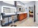 Modern bathroom featuring a vanity area with makeup lighting, a sink, and an entrance to a bedroom at 16044 Loire Valley Dr, Fishers, IN 46037