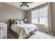 Cozy bedroom with a double bed, a nightstand, and a window with blinds providing natural light at 16044 Loire Valley Dr, Fishers, IN 46037