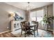 Chic dining room featuring a modern chandelier, stylish buffet, and a round table with seating for four at 16044 Loire Valley Dr, Fishers, IN 46037
