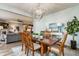 Open concept dining area with seating for six, adjacent to the living room, perfect for entertaining at 16044 Loire Valley Dr, Fishers, IN 46037