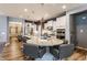 Open-concept kitchen featuring a large island with seating and modern pendant lighting at 16044 Loire Valley Dr, Fishers, IN 46037