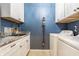 Functional laundry room with white cabinets, a utility sink, and a washer and dryer at 16044 Loire Valley Dr, Fishers, IN 46037