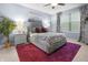 Inviting main bedroom with a plush bed, elegant side tables, and a large window with decorative curtains at 16044 Loire Valley Dr, Fishers, IN 46037