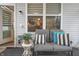 Relaxing outdoor porch with comfortable seating, stylish cushions, and views of the yard at 16044 Loire Valley Dr, Fishers, IN 46037