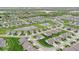 Serene aerial view of a residential community with multiple ponds nestled within lush greenery at 161 Tamarack Larch Blvd, Cicero, IN 46034