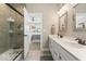 Bathroom showcasing a double vanity, glass-enclosed shower, and access to the bedroom at 161 Tamarack Larch Blvd, Cicero, IN 46034