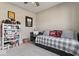 Spacious bedroom with a ceiling fan, a writing desk, and a comfortable trundle bed at 161 Tamarack Larch Blvd, Cicero, IN 46034