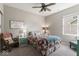 Comfortable bedroom with ceiling fan, rocking chair and natural light from a window at 161 Tamarack Larch Blvd, Cicero, IN 46034