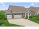 Lovely home with a spacious three-car garage, green lawn, and inviting curb appeal at 161 Tamarack Larch Blvd, Cicero, IN 46034