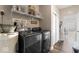 Well-equipped laundry room with modern appliances, storage, and stylish decor at 161 Tamarack Larch Blvd, Cicero, IN 46034
