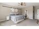 Serene main bedroom featuring carpet floors and barn-style doors for a rustic touch at 161 Tamarack Larch Blvd, Cicero, IN 46034