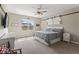 Inviting main bedroom with a comfortable bed, ample natural light, and barn door accents at 161 Tamarack Larch Blvd, Cicero, IN 46034