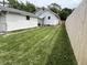 View of backyard with new fence and storage shed offering ample outdoor space and privacy at 1622 S Randolph St, Indianapolis, IN 46203